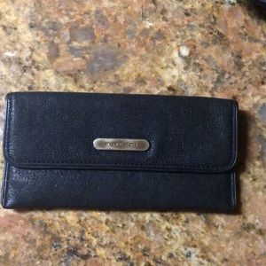 Michael Korda black leather wallet.
